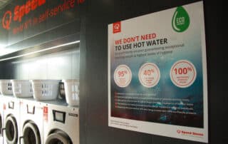 In a laundry room, a poster highlights the significance of water conservation, encouraging mindful usage of this vital resource.